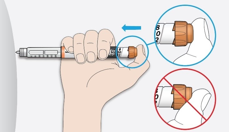 Placera tummen på injektionsknappen. Tryck därefter in knappen hela vägen och håll kvar